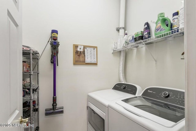 laundry area with washing machine and clothes dryer