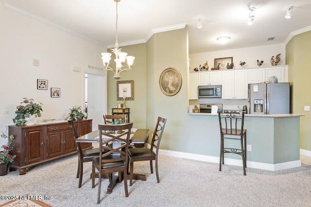 carpeted dining room featuring crown molding and a chandelier