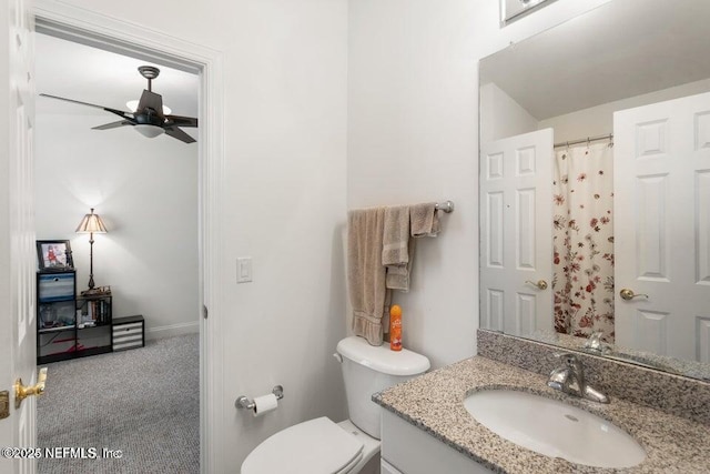 bathroom with vanity, ceiling fan, and toilet