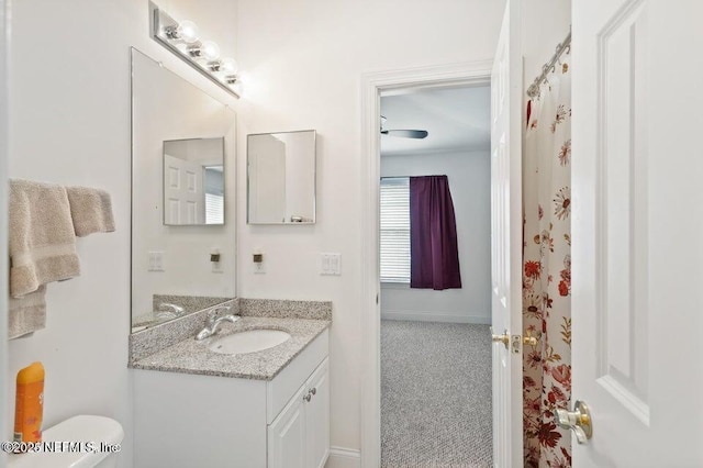 bathroom with vanity and toilet