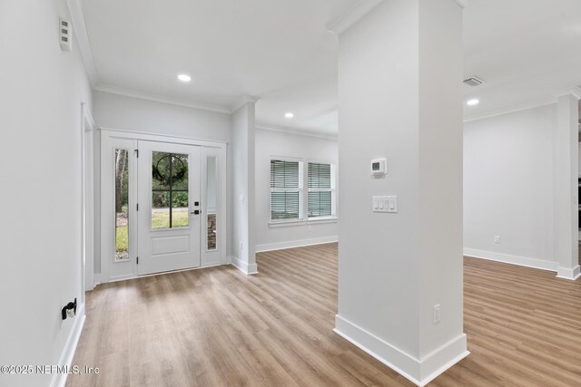 85034 Southern Creek Blvd, Fernandina Beach, FL 32034 - entryway featuring ornamental molding and light hardwood / wood-style flooring
