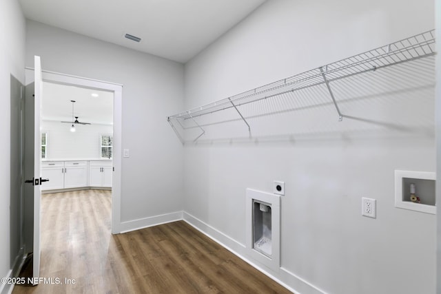 85034 Southern Creek Blvd, Fernandina Beach, FL 32034 - laundry room with ceiling fan, dark hardwood / wood-style floors, washer hookup, a fireplace, and hookup for an electric dryer
