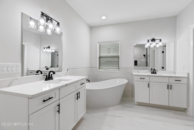 85034 Southern Creek Blvd, Fernandina Beach, FL 32034 - bathroom with vanity, a bath, and tile walls