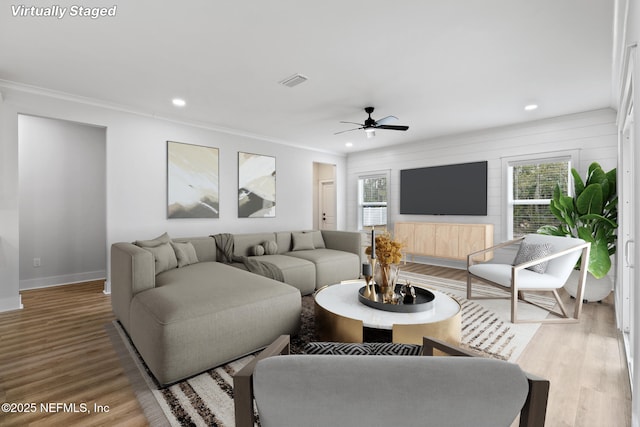 85034 Southern Creek Blvd, Fernandina Beach, FL 32034 - living room with hardwood / wood-style floors, crown molding, and ceiling fan