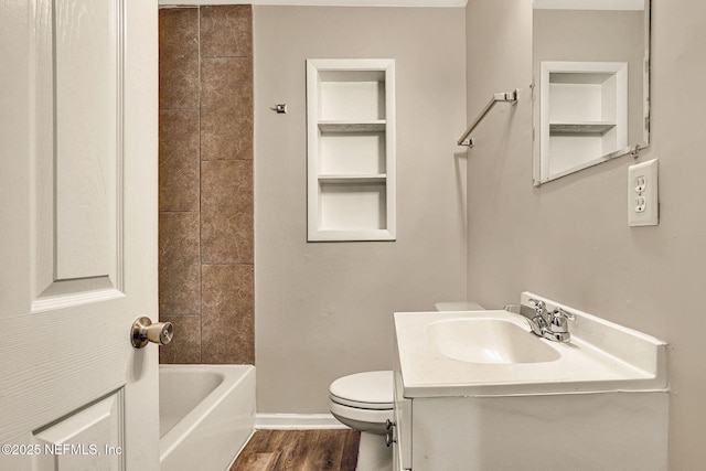 bathroom featuring vanity, wood-type flooring, and toilet