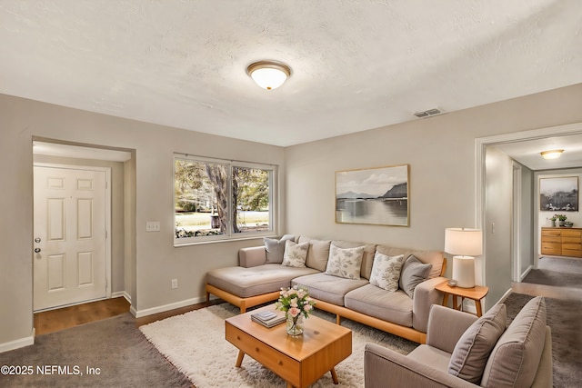 living room featuring a textured ceiling