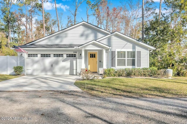 ranch-style house with driveway, a front lawn, an attached garage, and fence