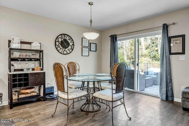 dining room with wood finished floors and baseboards