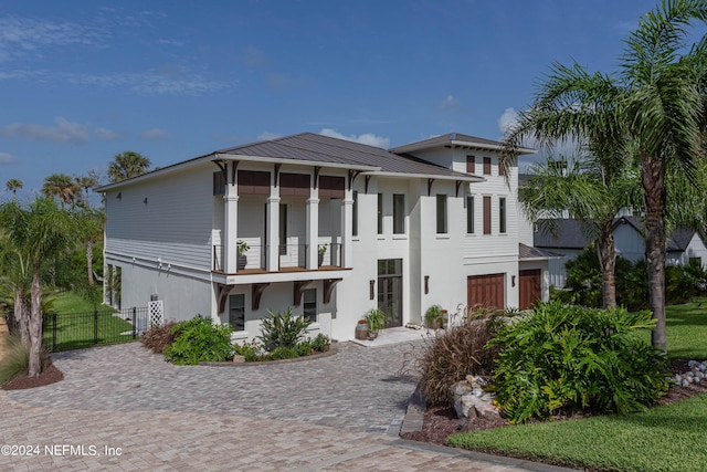 view of front of property featuring a balcony