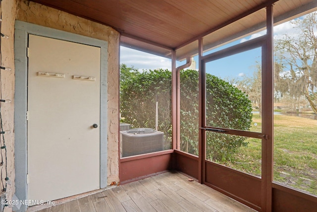 unfurnished sunroom featuring wood ceiling