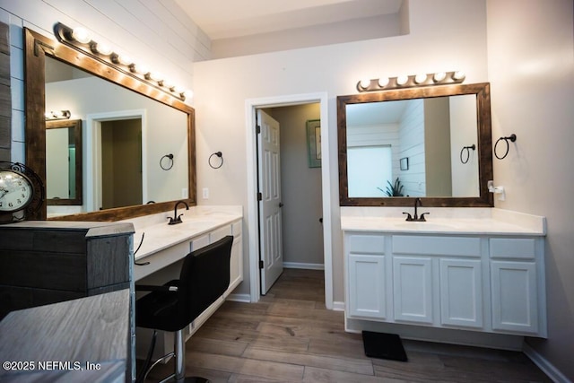 bathroom with vanity and wood-type flooring