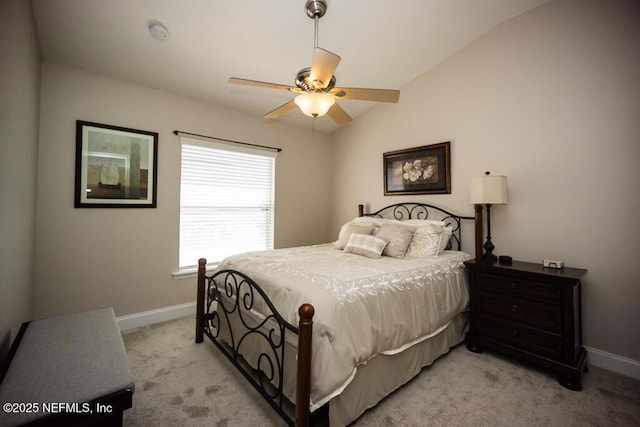 carpeted bedroom featuring ceiling fan and vaulted ceiling