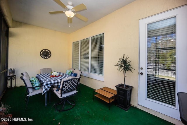 view of patio featuring ceiling fan