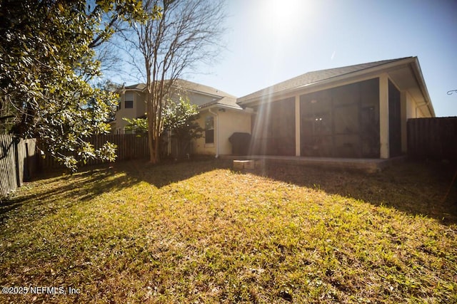 view of yard featuring a sunroom