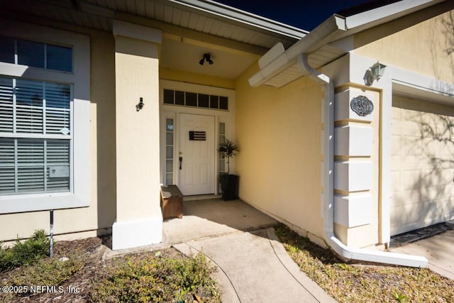 entrance to property featuring a garage