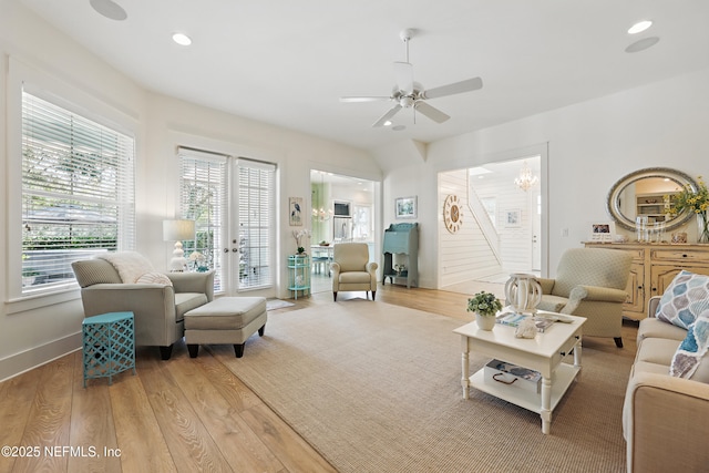 living room with baseboards, a ceiling fan, wood finished floors, and recessed lighting