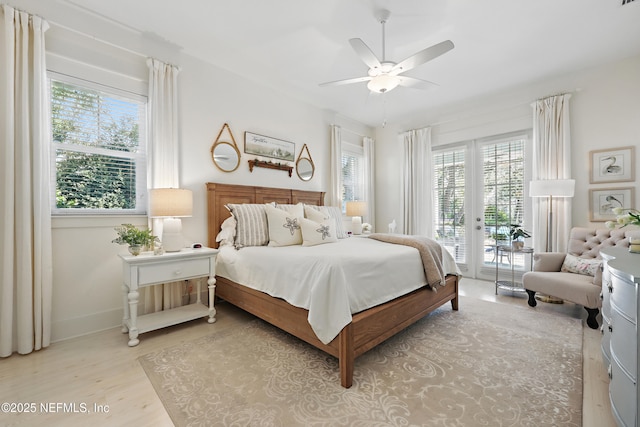 bedroom with light wood-style floors, access to outside, baseboards, and ceiling fan