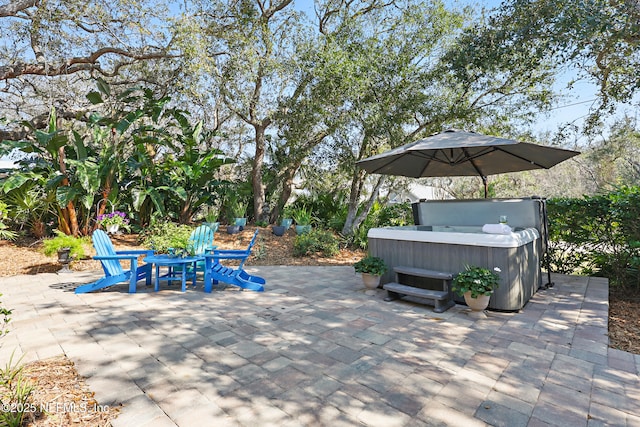 view of patio with a hot tub