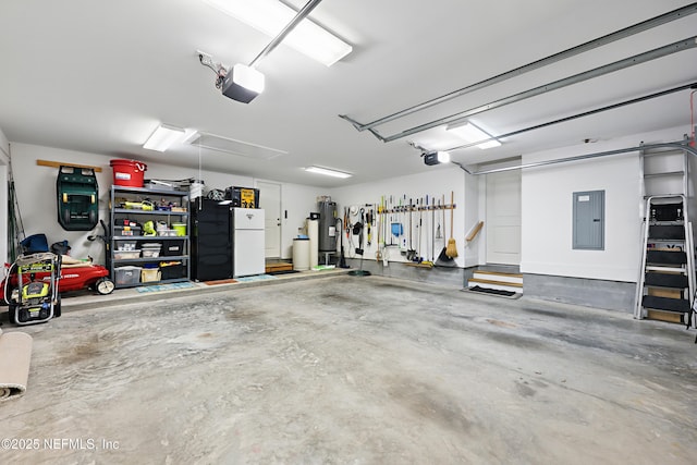 garage featuring electric panel, water heater, a garage door opener, and freestanding refrigerator