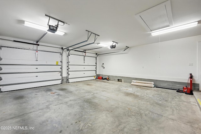 garage featuring a garage door opener