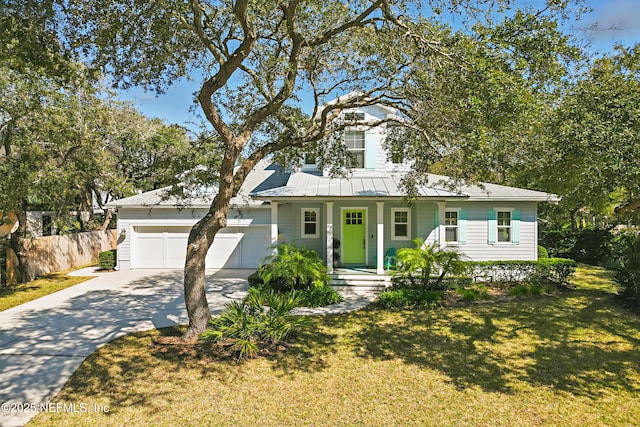 view of front of property with concrete driveway, an attached garage, fence, a front lawn, and a porch