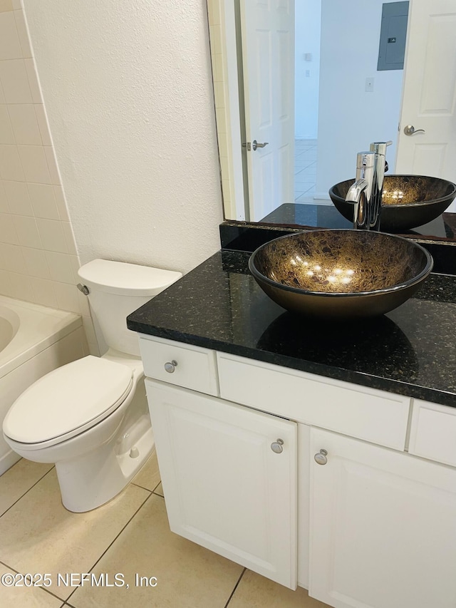 bathroom with vanity, tile patterned floors, toilet, and electric panel