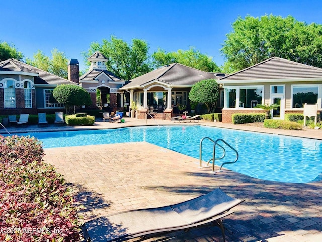 view of pool featuring a patio