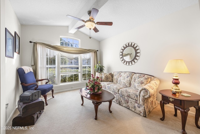 living room with plenty of natural light, lofted ceiling with beams, light carpet, and a textured ceiling