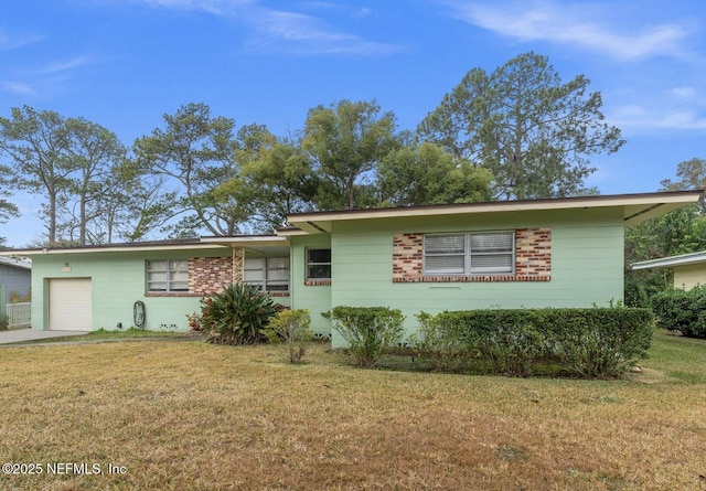 single story home with a garage and a front yard