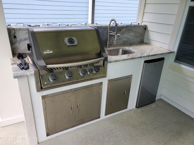 view of patio / terrace featuring area for grilling, sink, and grilling area