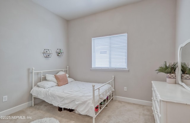 bedroom with light colored carpet