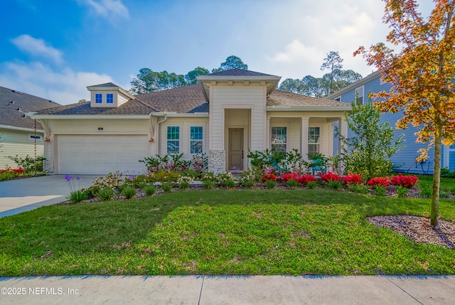 view of front of house with a garage and a front lawn