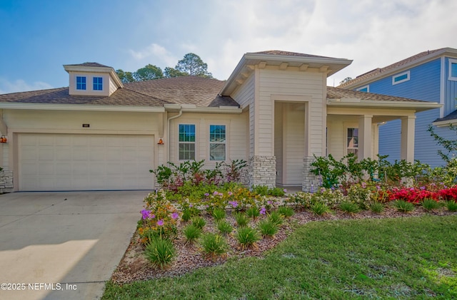 view of front of property with a garage