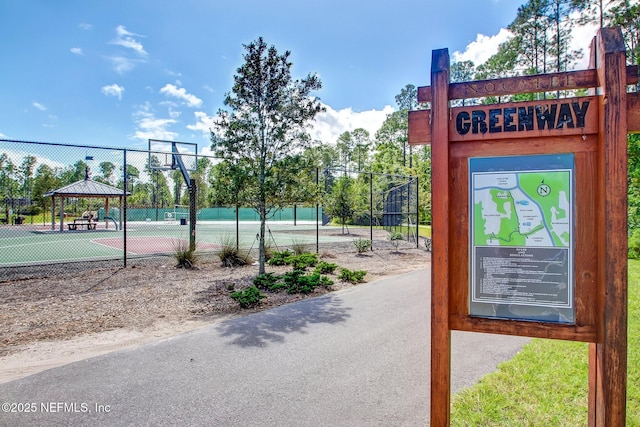 exterior space featuring basketball court, a gazebo, and tennis court