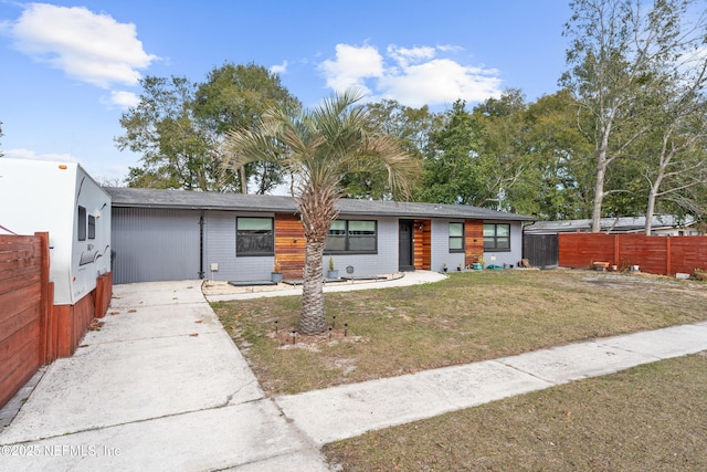 ranch-style house with a front yard