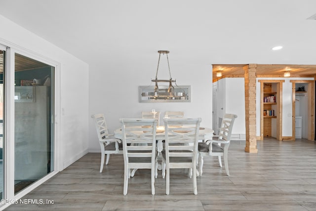 dining area with hardwood / wood-style flooring