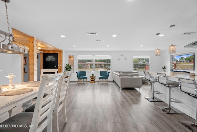 dining area with hardwood / wood-style flooring