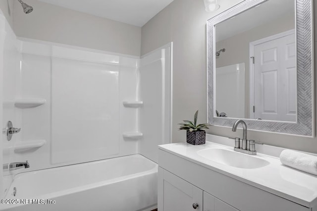 bathroom with vanity and shower / bathing tub combination