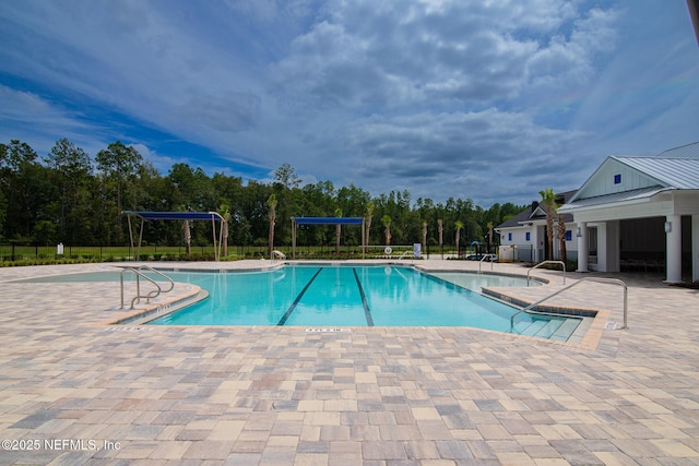 view of swimming pool featuring a patio