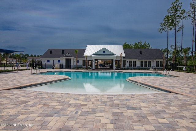 view of swimming pool with a patio