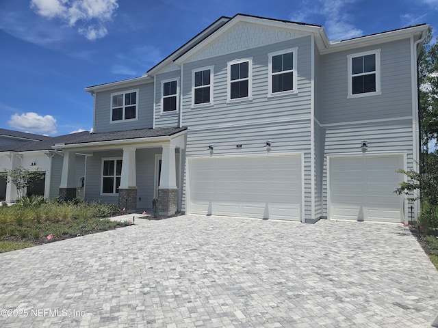 280 Dalton Mill Dr, Saint Johns, FL 32259 - view of front of house with decorative driveway and an attached garage