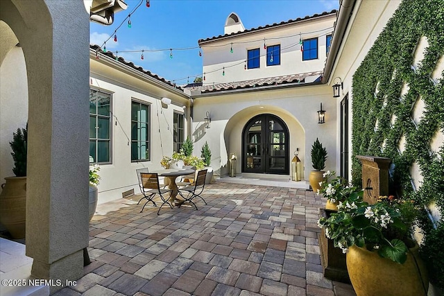 view of patio featuring french doors