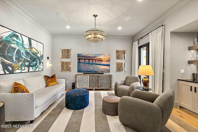 living room featuring crown molding and light hardwood / wood-style flooring