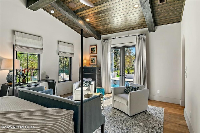 bedroom with wood ceiling, hardwood / wood-style flooring, lofted ceiling with beams, access to outside, and french doors