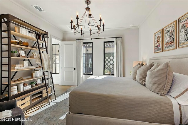 bedroom with ornamental molding, a chandelier, and wood-type flooring