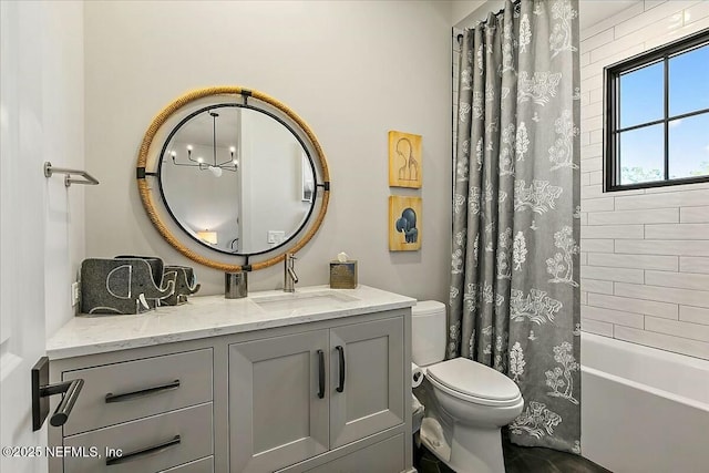 full bathroom with vanity, toilet, and shower / bath combo