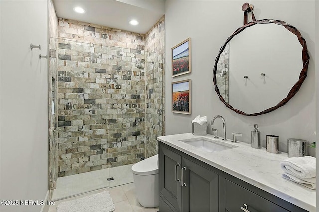 bathroom featuring an enclosed shower, vanity, tile patterned floors, and toilet