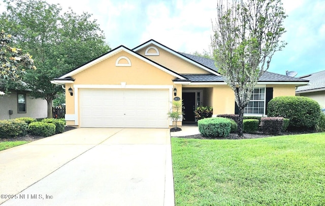 ranch-style home with a garage and a front lawn