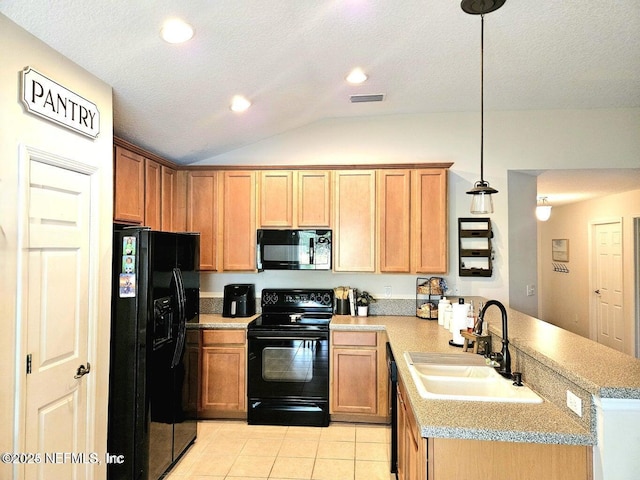 kitchen with sink, vaulted ceiling, hanging light fixtures, kitchen peninsula, and black appliances