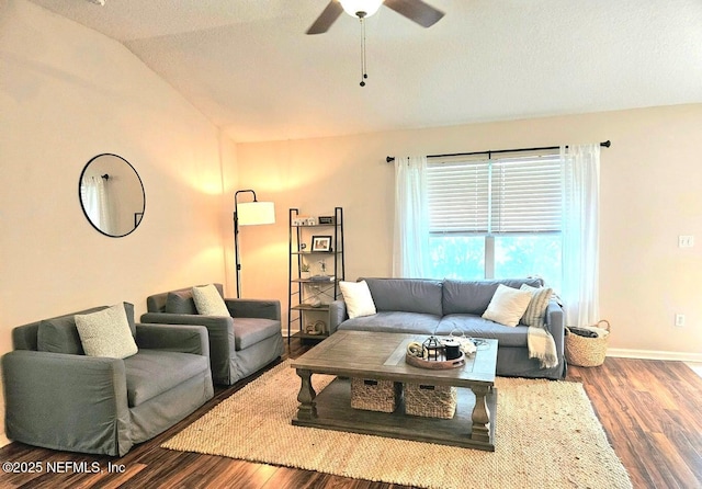 living room with ceiling fan, dark hardwood / wood-style flooring, and vaulted ceiling